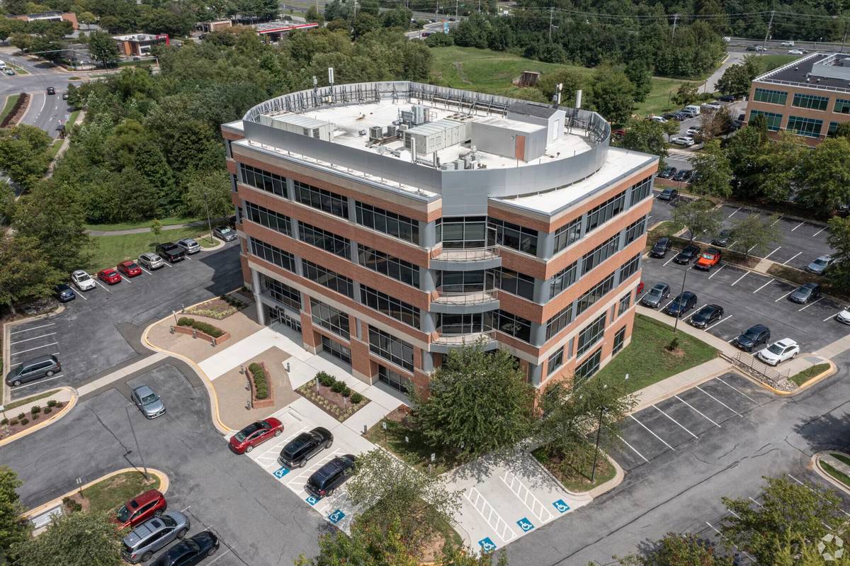 Aerial view of 4201 Mitchellville Road with surrounding parkland and free surface parking