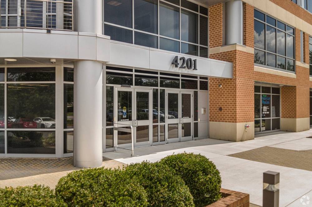 The 4201 entrance with glass doors and building signage