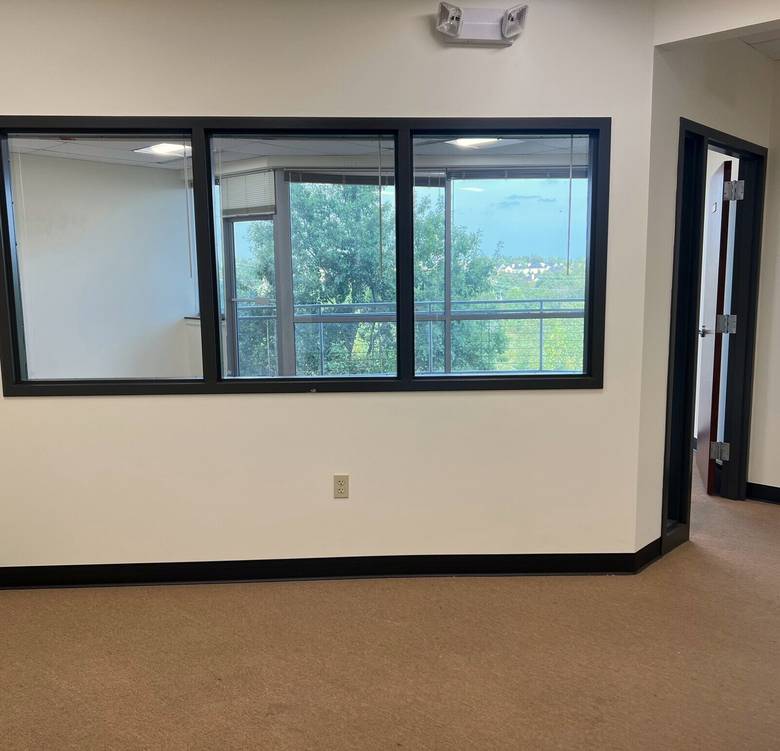 Corner office interior with wraparound windows